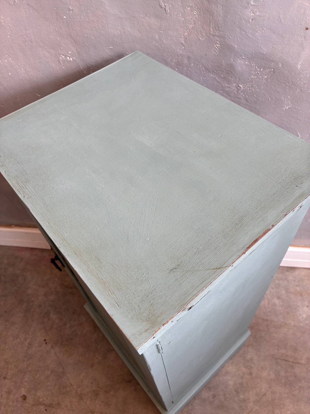 Top view of a vintage painted pot cupboard in duck egg blue, showcasing its rustic finish and charming design.
