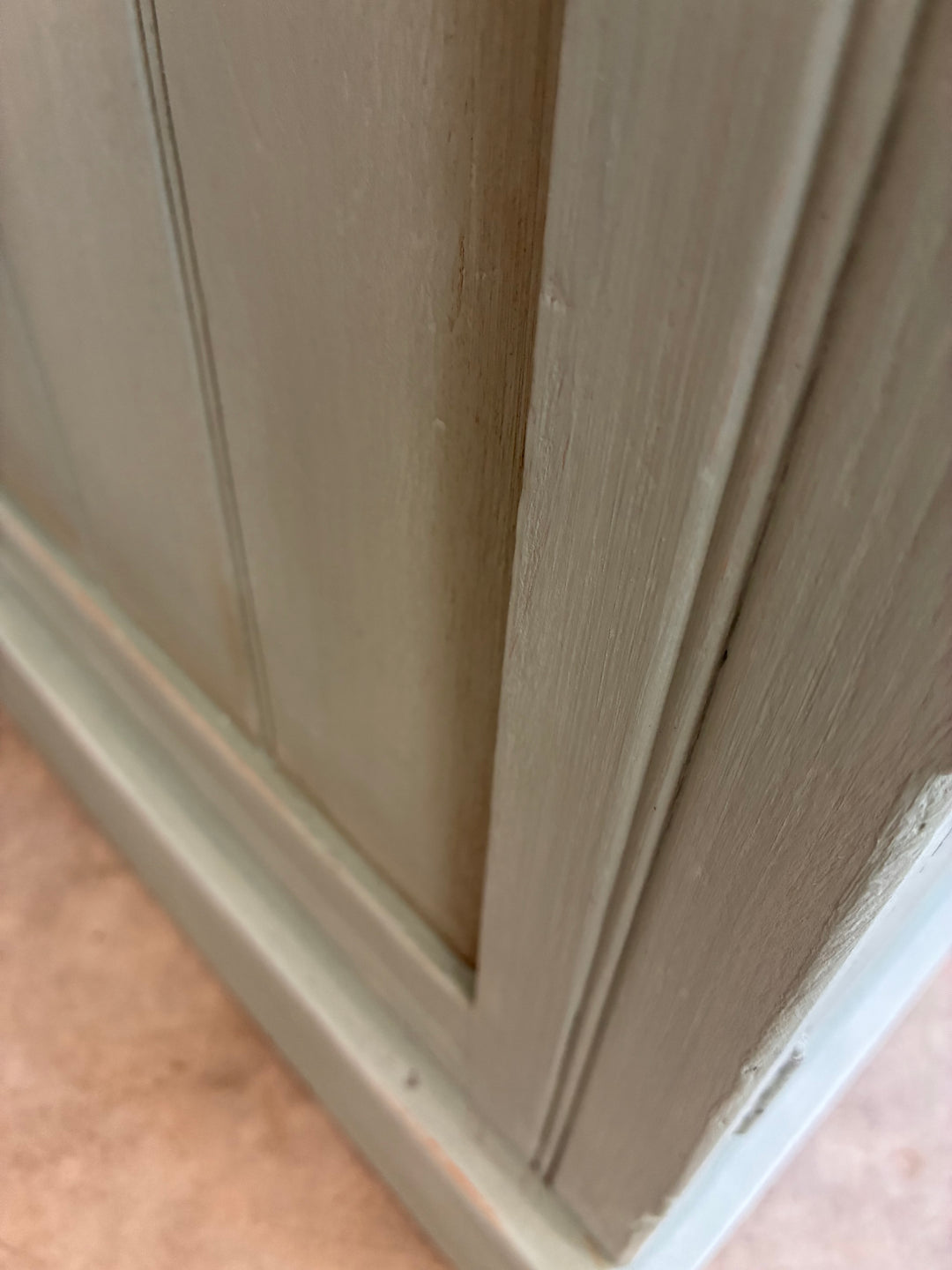Close-up of the vintage painted pot cupboard in duck egg blue, showcasing its rustic finish and wooden texture.