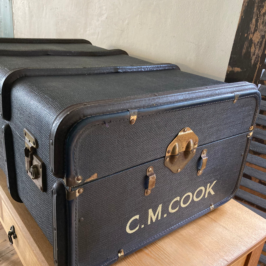 CM Cook stencilled on the end of a travelling trunk