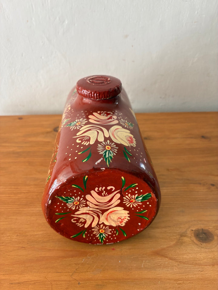 Vintage Royal Doulton Stoneware Foot Warmer - Painted Toleware with floral design on a brick red background.