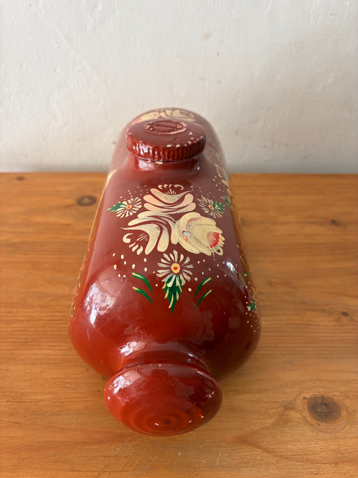 Vintage Royal Doulton Stoneware Foot Warmer - Painted Toleware with floral designs on a brick red background.