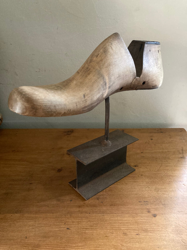wooden shoe last mounted on a metal base