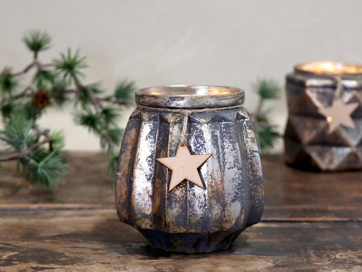wooden star suspended with rustic twine on a glass teaight holder