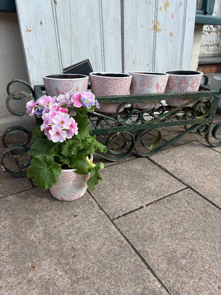 Vintage Painted Wrought Iron Trough Planter with pink flowers, adding rustic charm to any garden from Source for the Goose, Devon.