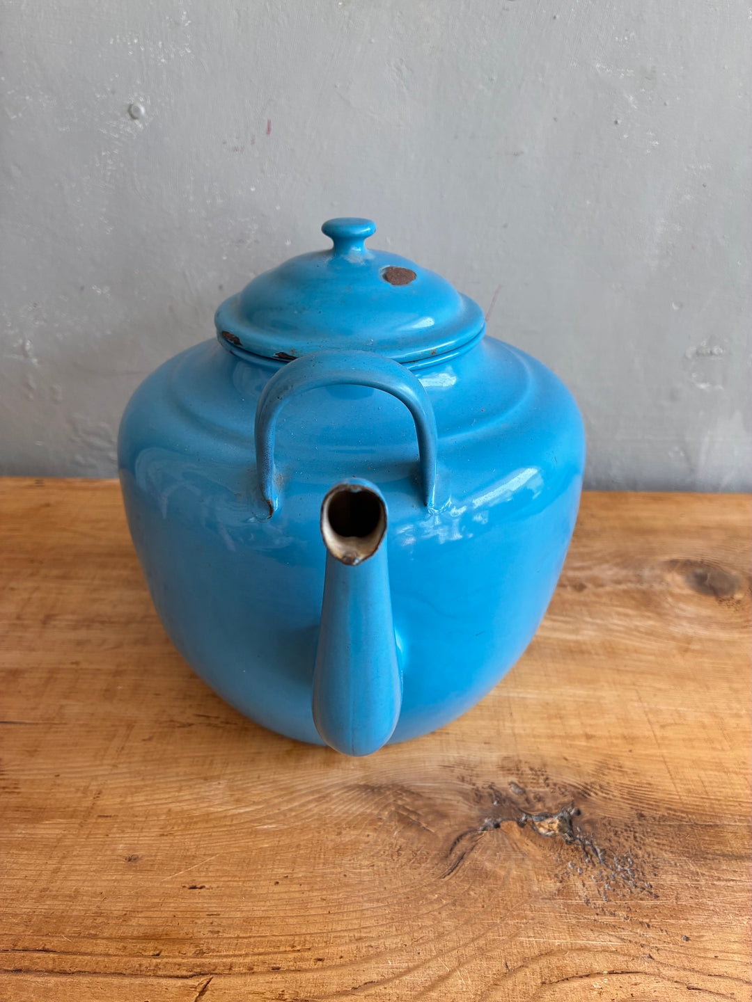 Large Vintage Blue Enamel Teapot on a wooden surface, showcasing its charming robin's egg blue enamel finish.
