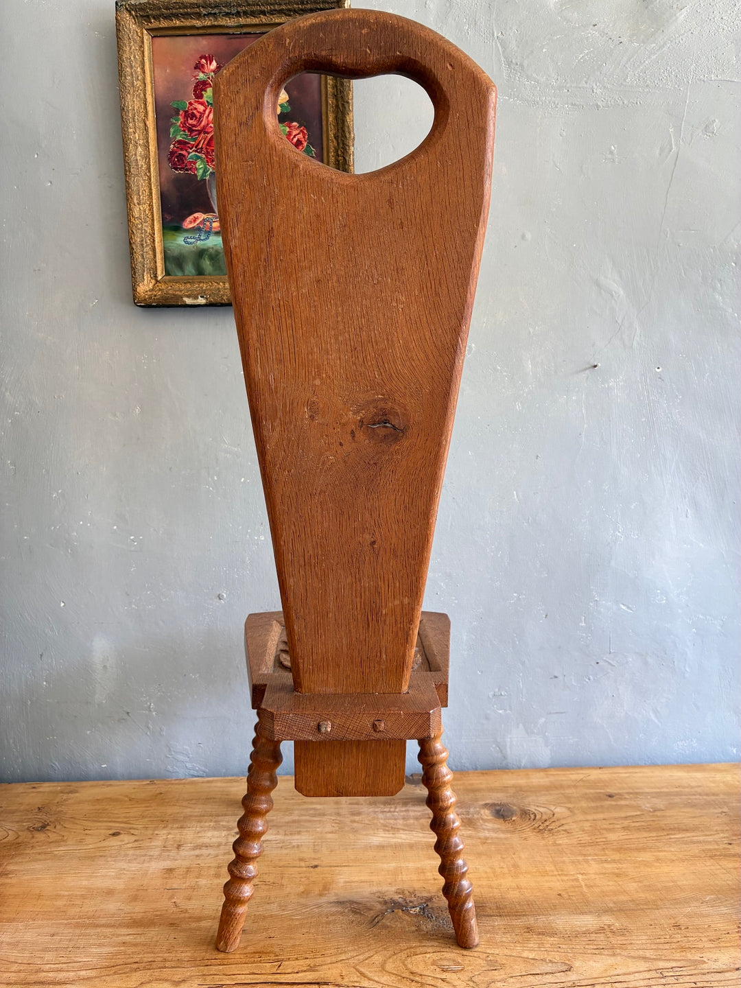Vintage Spinning Chair with heart-shaped cutout backrest and turned bobbin legs, perfect side table.