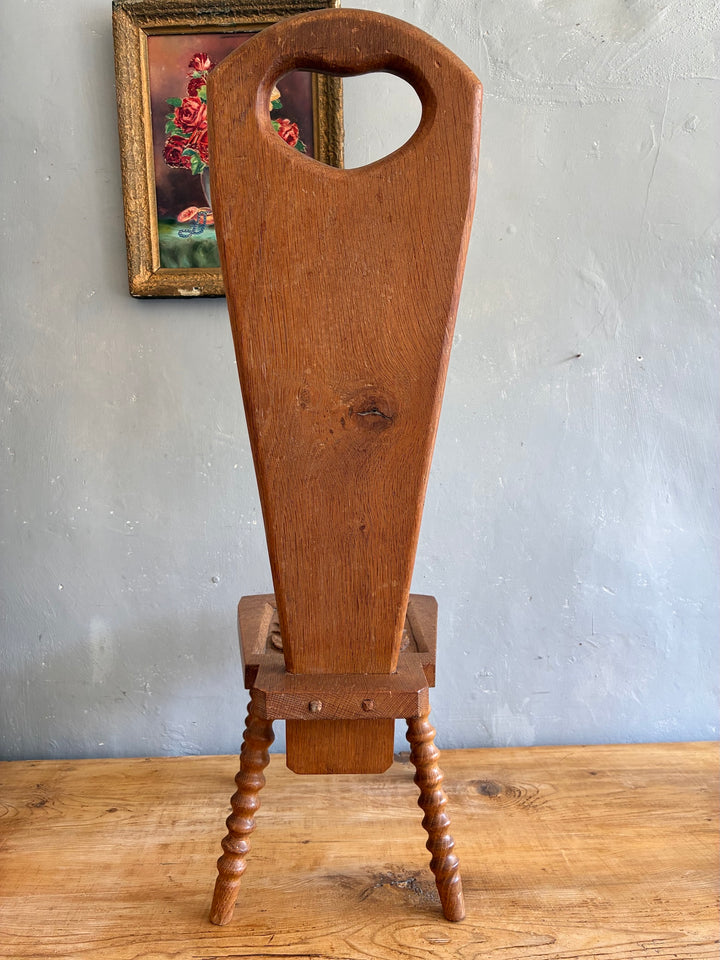 Vintage Spinning Chair with heart-shaped cutout backrest and turned bobbin legs, perfect side table.