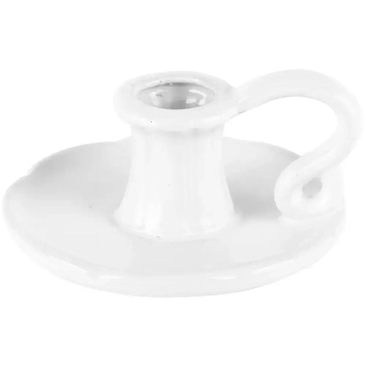Vintage style white ceramic candle holder with sturdy base and handle, perfect for adding a touch of elegance and warmth to any home decor.