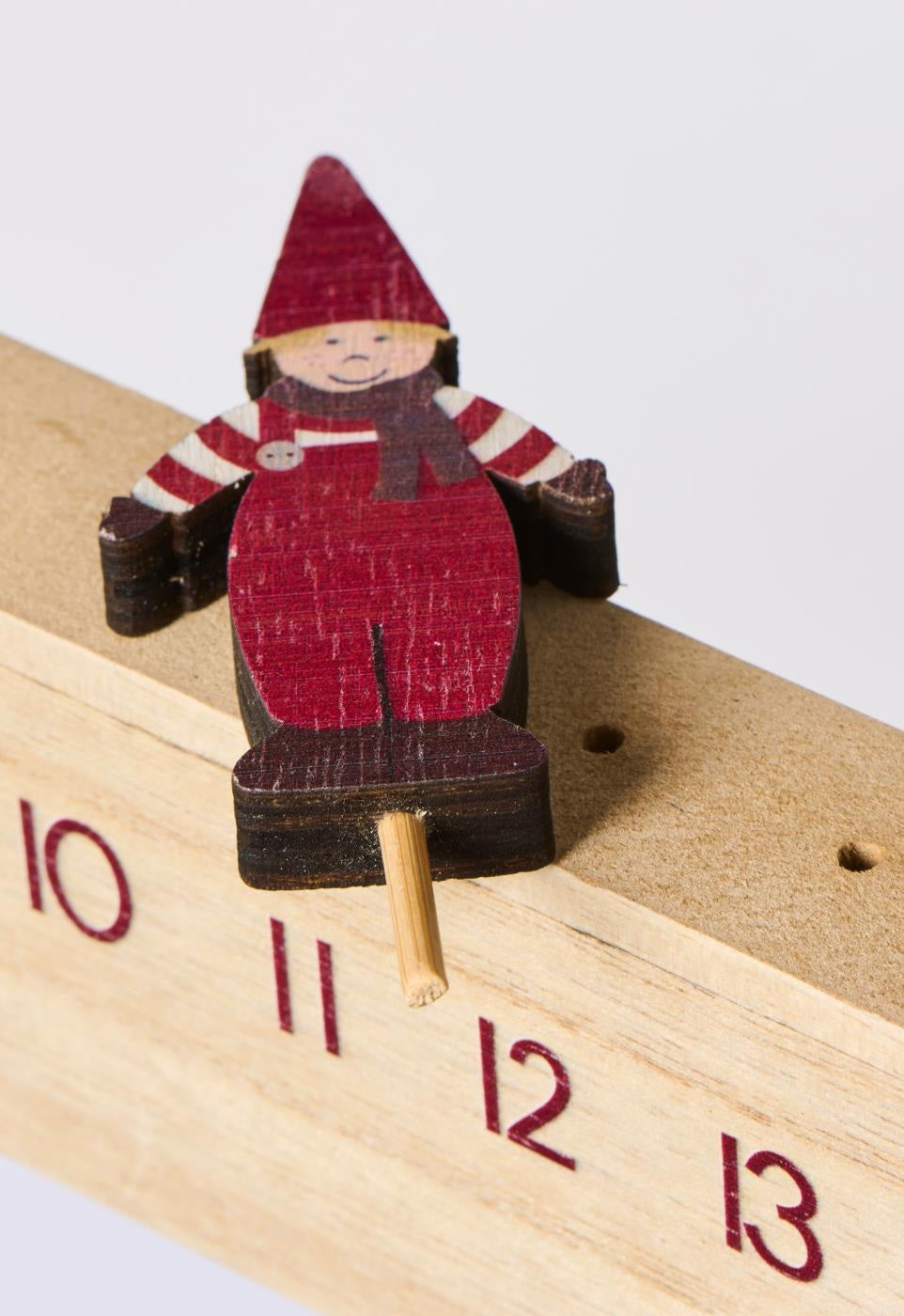 Wooden advent calendar with Santa's helper, enhancing Christmas countdown charm. Source for the Goose, Devon.