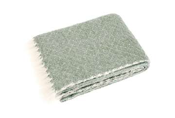 Wool Blend Sage Green Throw by Source for the Goose, folded with soft tassels for a cozy addition to any room.