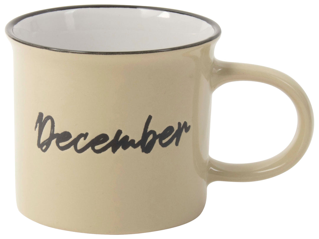 Cream ceramic mug with December script