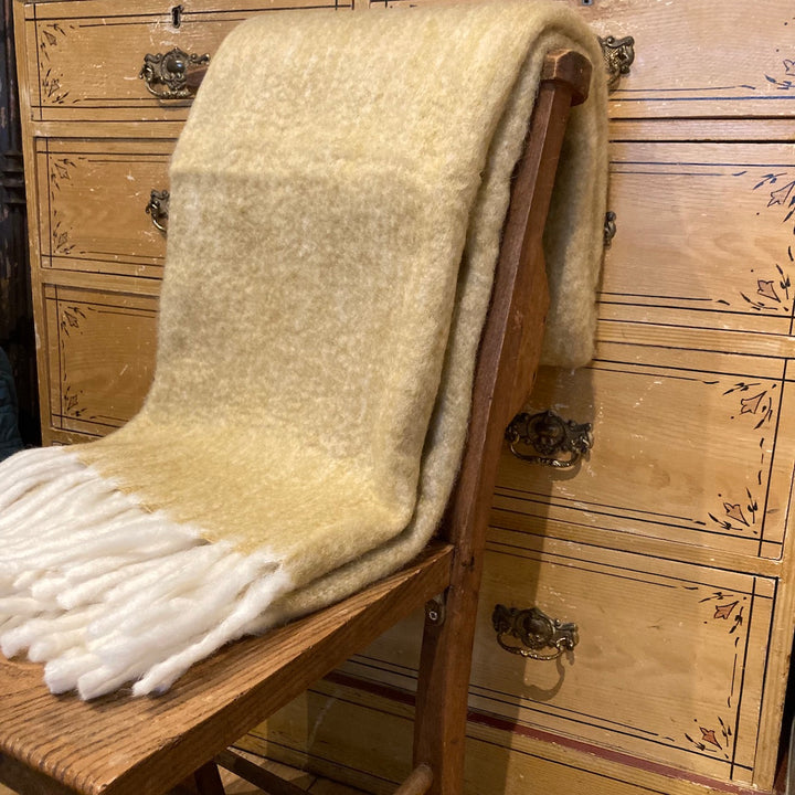 yellow blanket with cream tassels for sale at Source for the Goose, Devon, UK