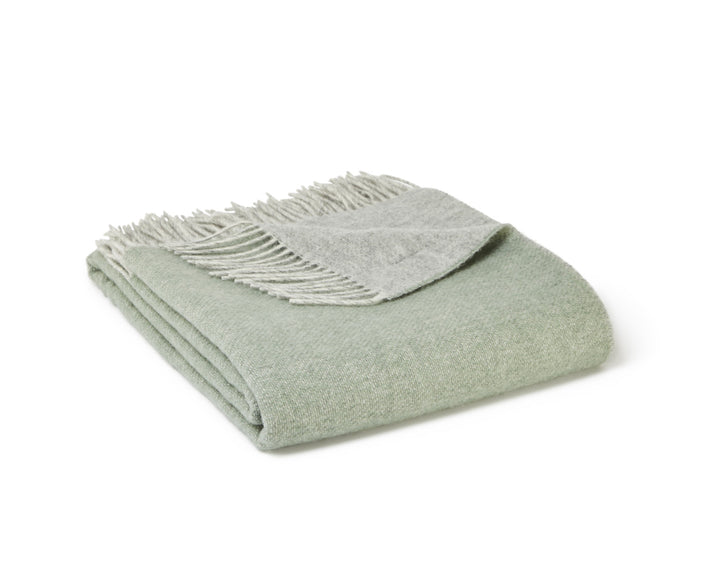green and grey wool blanket by Tweedmill