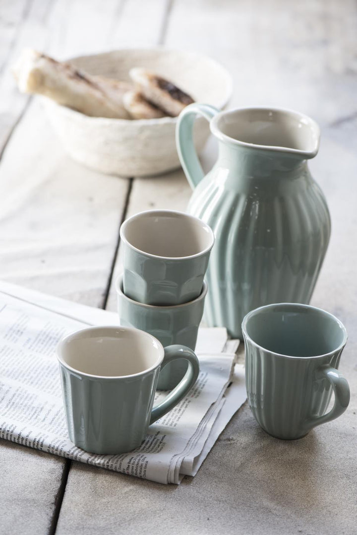 sage green stoneware mugs and jug